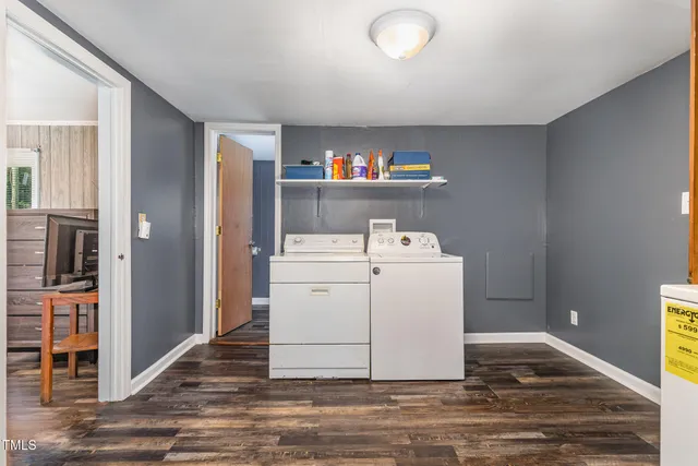 a view of washer and dryer with wooden floor