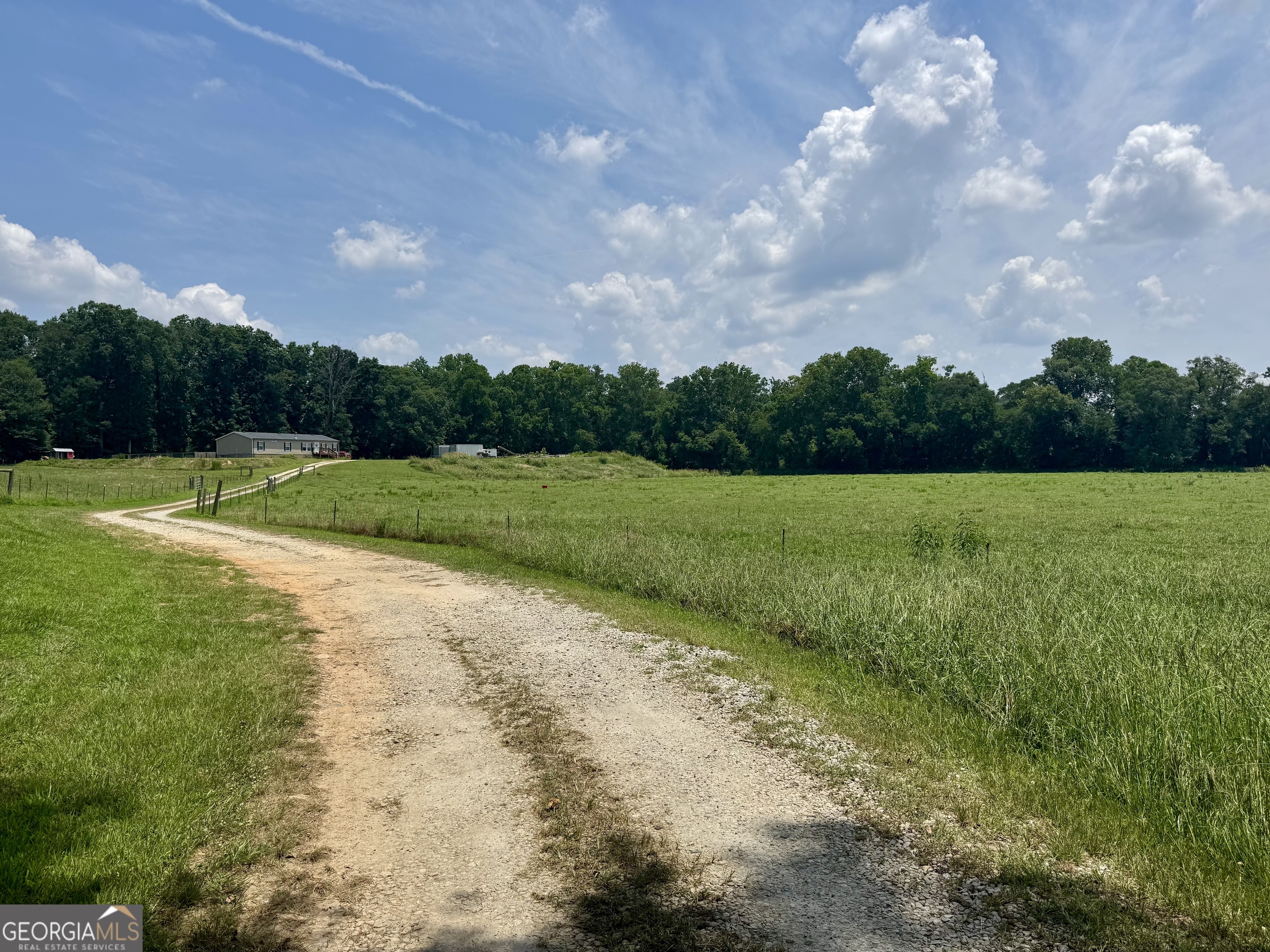 1148 Beaver Dam Road Hoschton, GA 30548 - Photo 4 of 11 a view of a grassy field