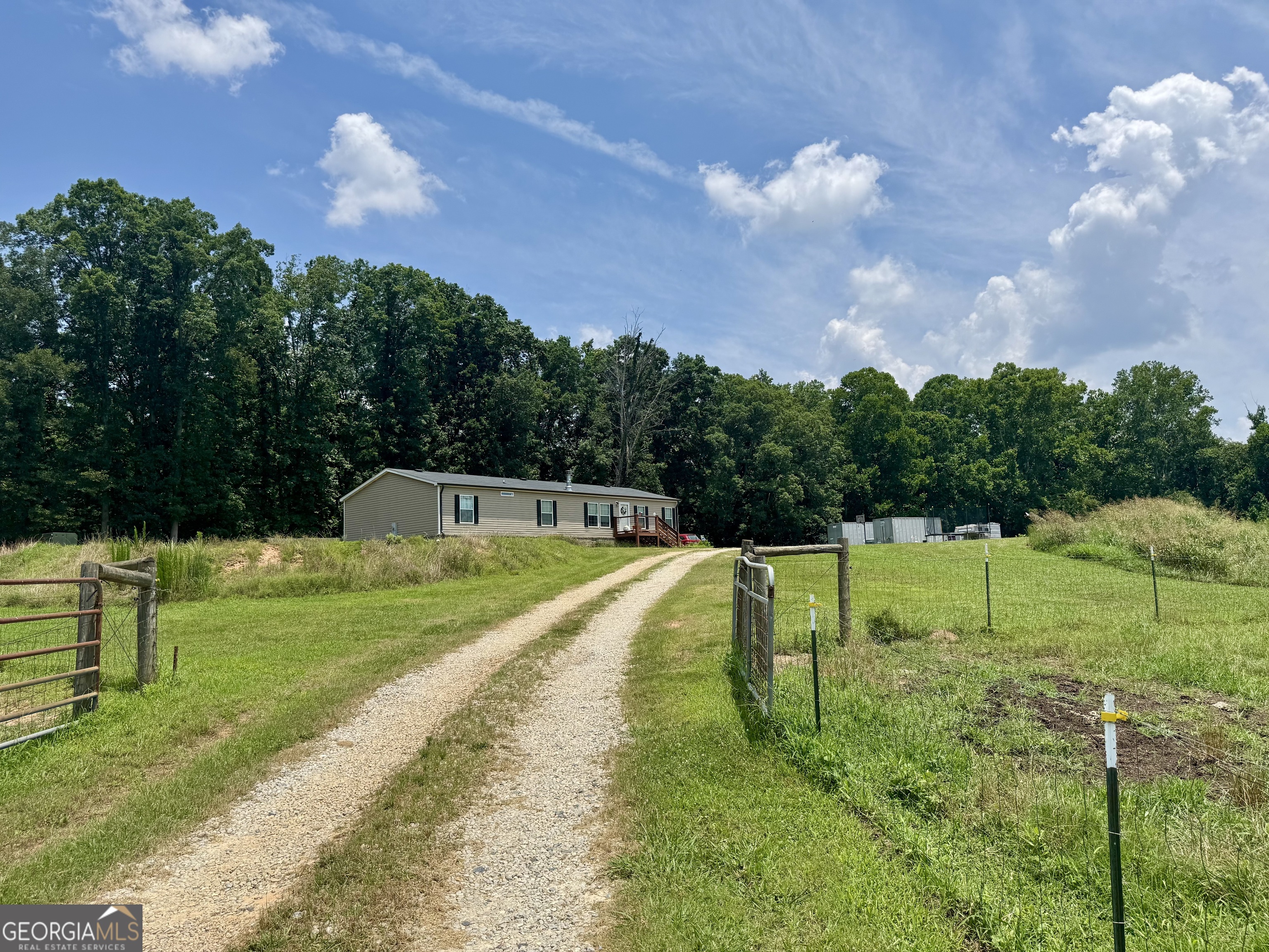 1148 Beaver Dam Road Hoschton, GA 30548 - Photo 5 of 11 a view of a swimming pool with a yard