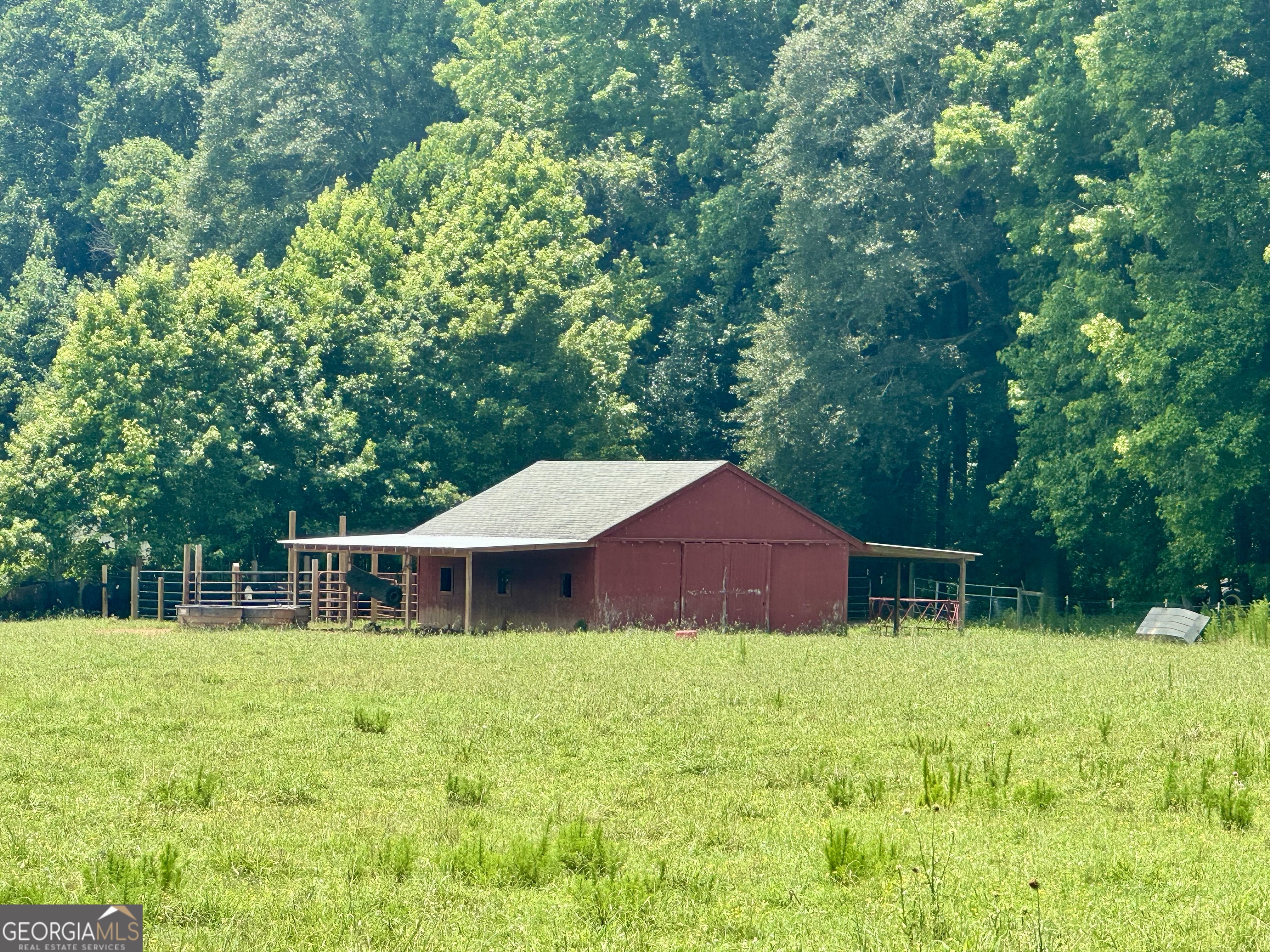 1148 Beaver Dam Road Hoschton, GA 30548 - Photo 8 of 11 front view of a house with a yard