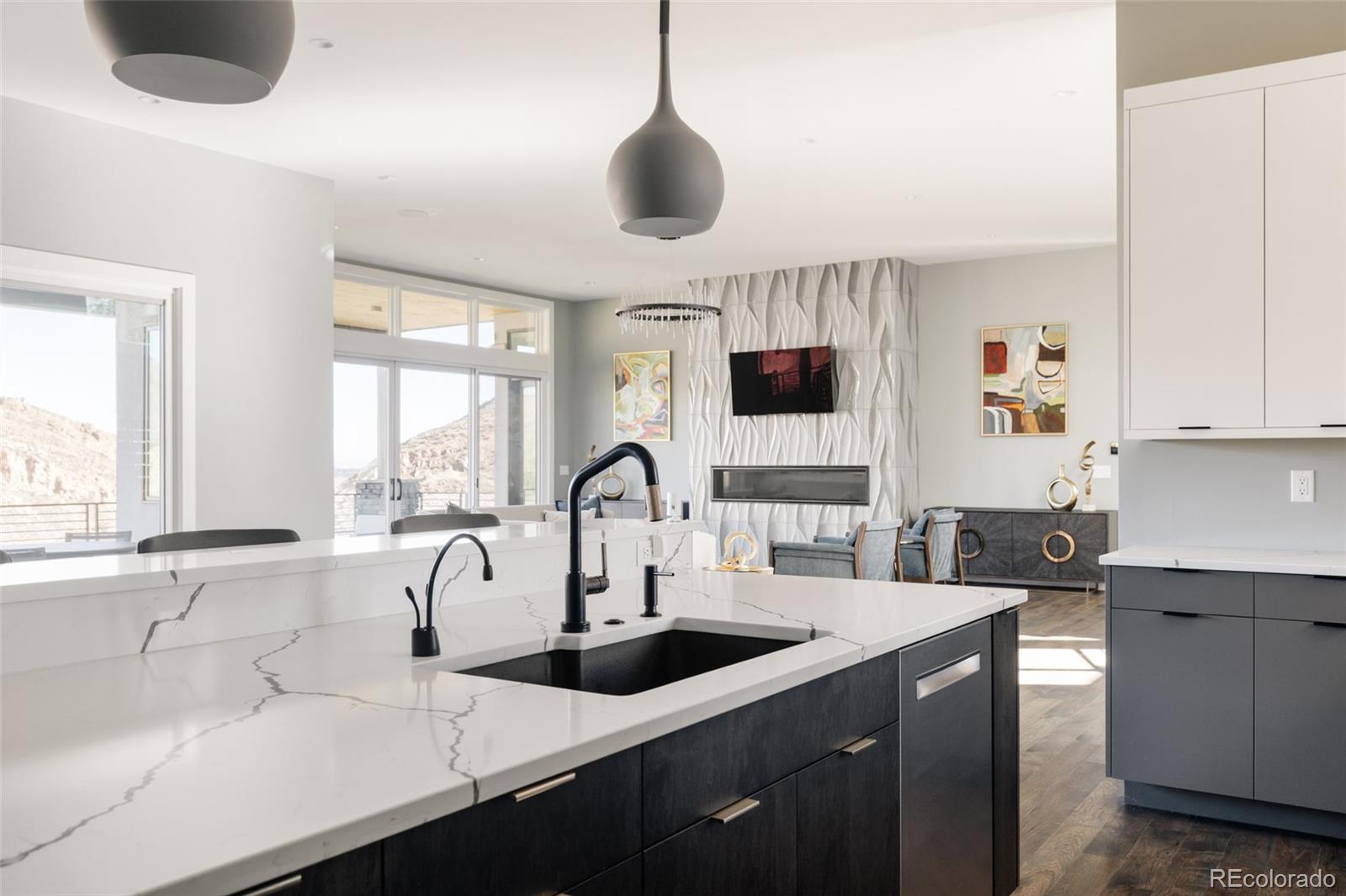 15480 Dinosaur Ridge Road Morrison, CO 80465 - Photo 13 of 50 a kitchen with a sink a counter top space and cabinets