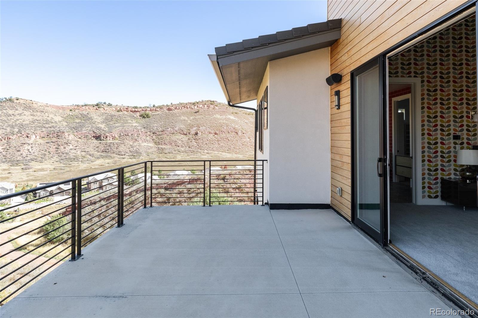 15480 Dinosaur Ridge Road Morrison, CO 80465 - Photo 26 of 50 a view of balcony with furniture