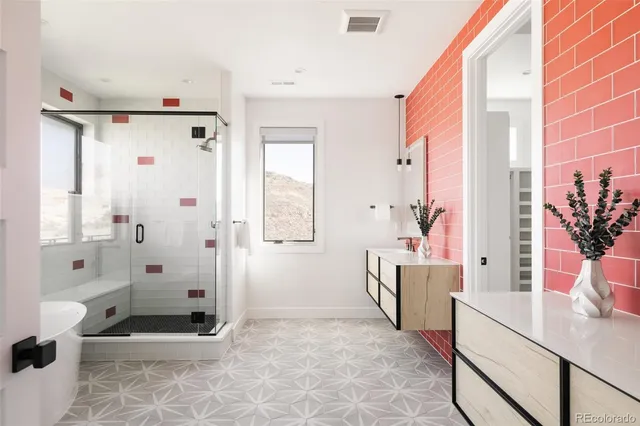 a bathroom with a bathtub sink mirror and toilet