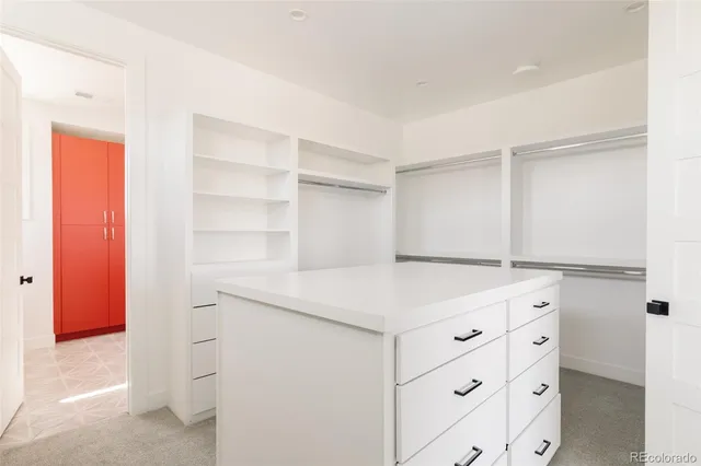 a kitchen with a cabinets and a window