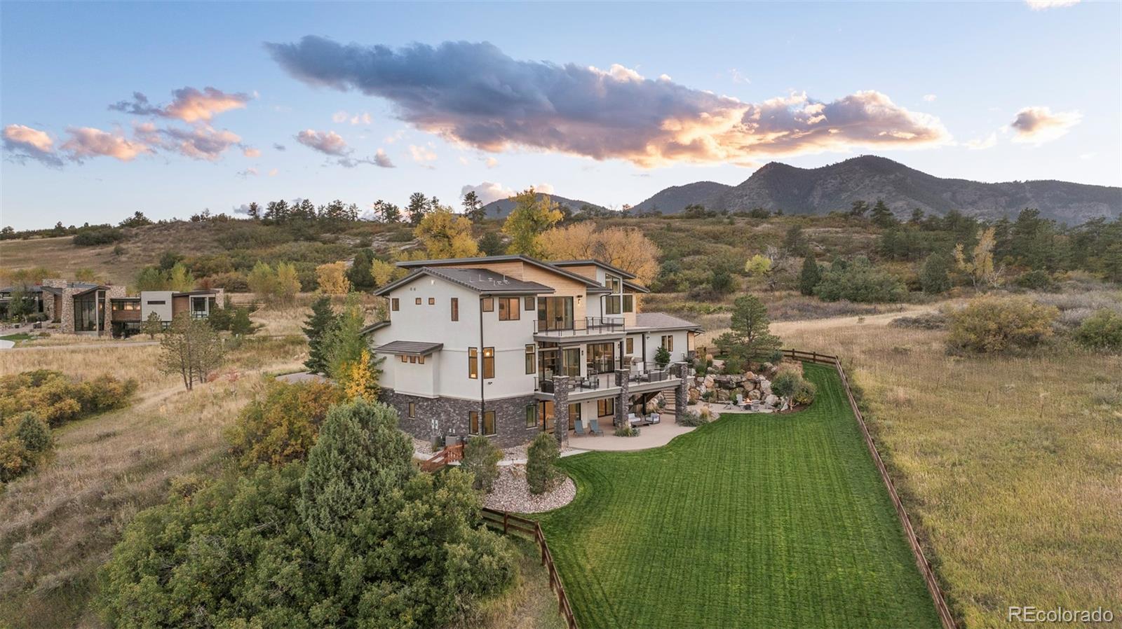 15480 Dinosaur Ridge Road Morrison, CO 80465 - Photo 3 of 50 a view of a town with mountains in the background