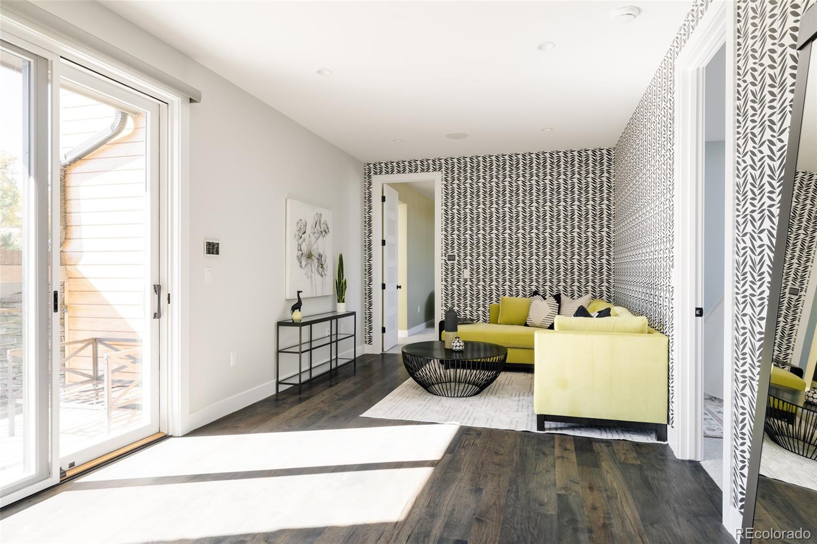 15480 Dinosaur Ridge Road Morrison, CO 80465 - Photo 31 of 50 a living room with furniture and a window