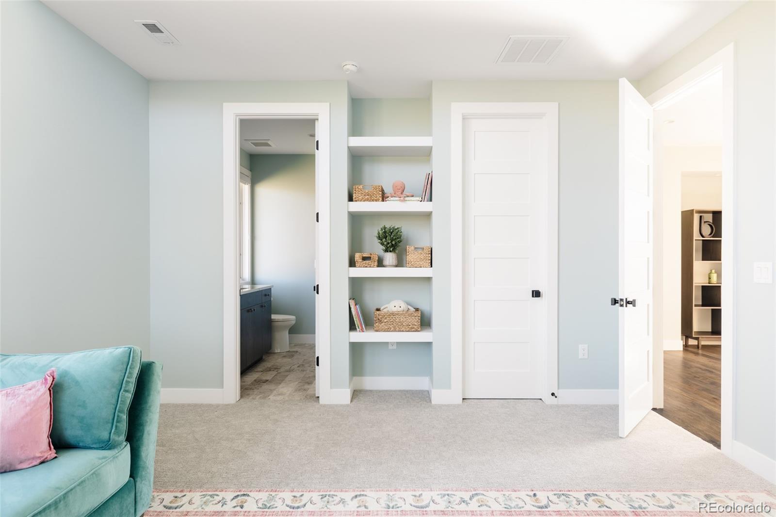 15480 Dinosaur Ridge Road Morrison, CO 80465 - Photo 33 of 50 a living room with furniture and painting on the wall