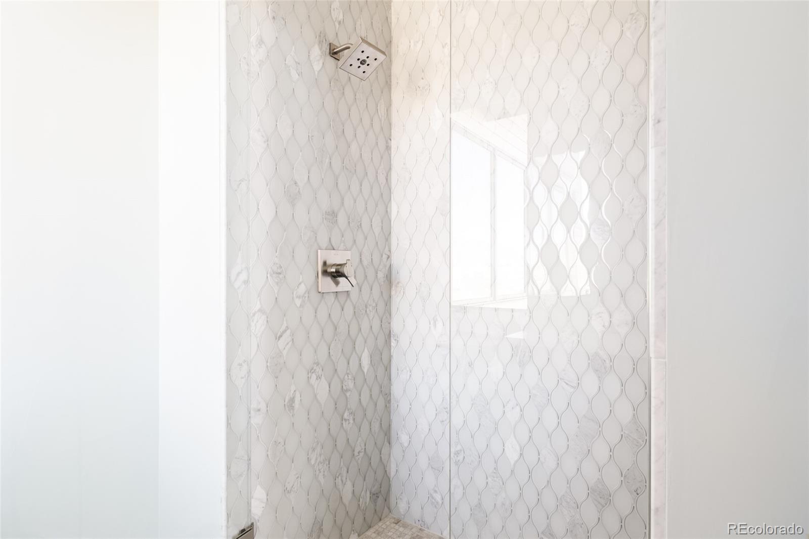 15480 Dinosaur Ridge Road Morrison, CO 80465 - Photo 35 of 50 a bathroom with a shower