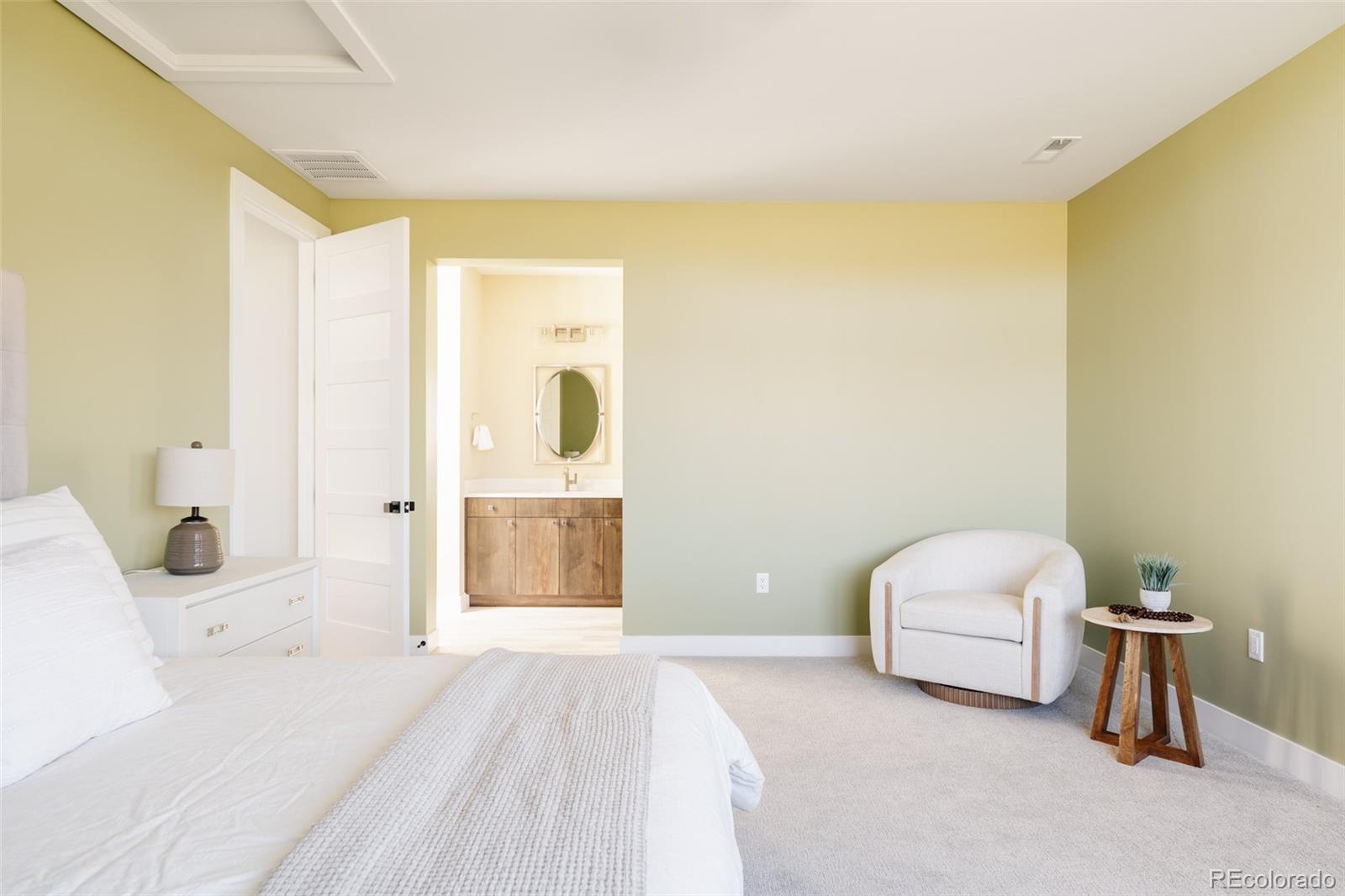 15480 Dinosaur Ridge Road Morrison, CO 80465 - Photo 37 of 50 a bedroom with a bed and a window