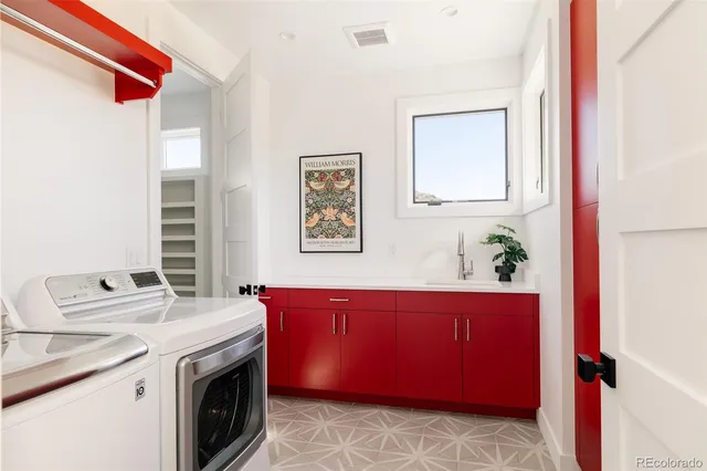 a view of cabinets with washer and dryer