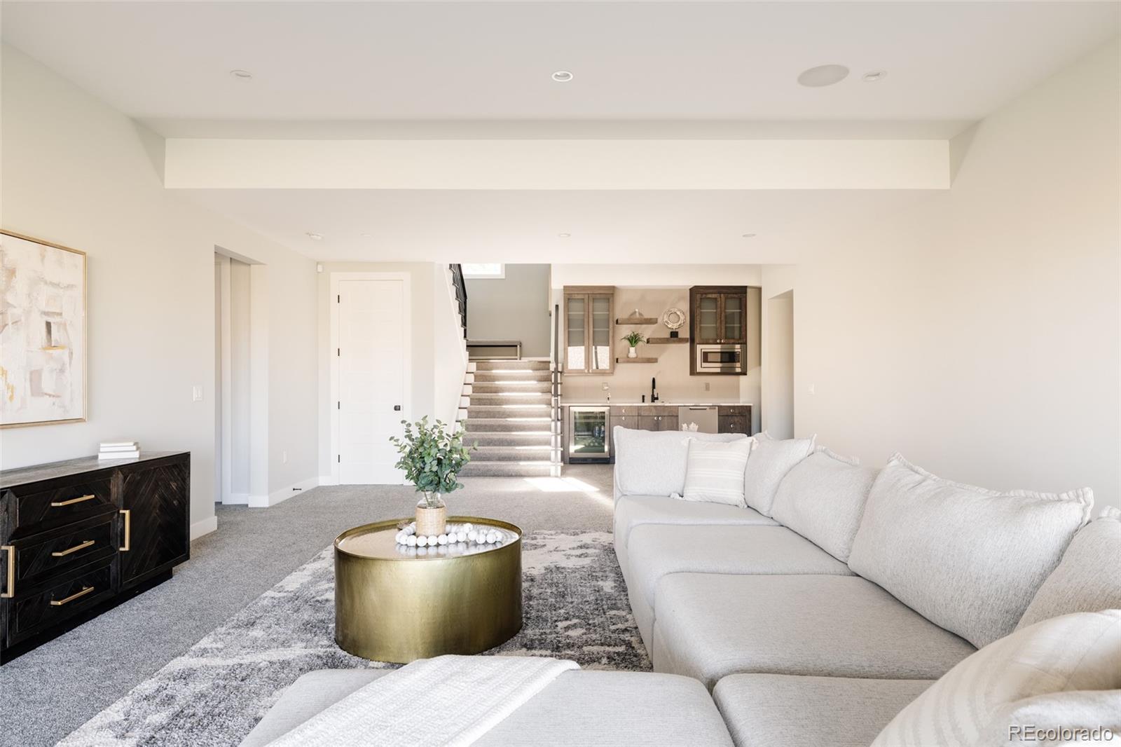 15480 Dinosaur Ridge Road Morrison, CO 80465 - Photo 43 of 50 a living room with furniture and a potted plant