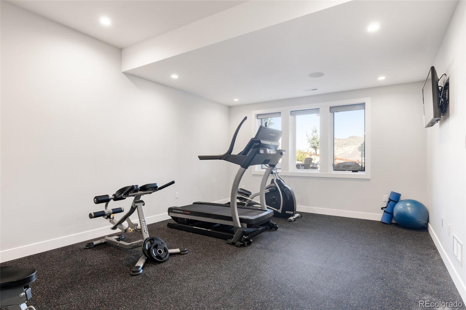 15480 Dinosaur Ridge Road Morrison, CO 80465 - Photo 46 of 50 a view of a room with gym equipment