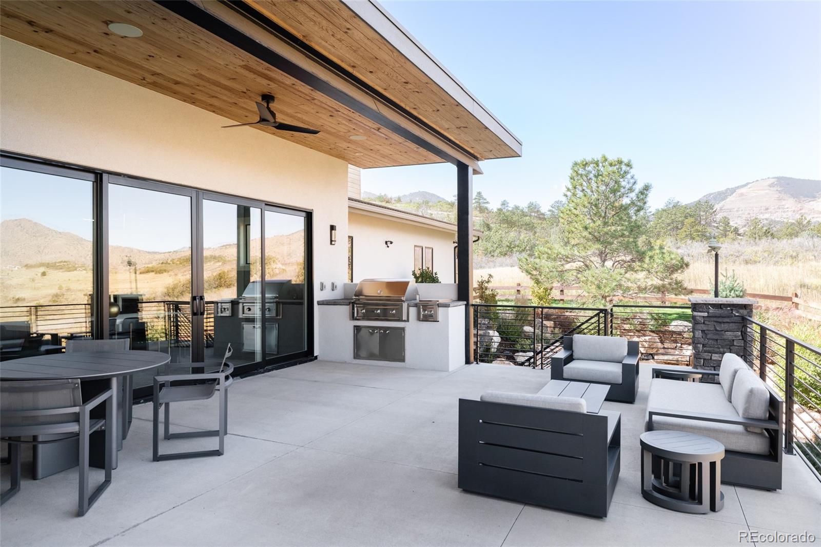 15480 Dinosaur Ridge Road Morrison, CO 80465 - Photo 48 of 50 a balcony with furniture and a view of city