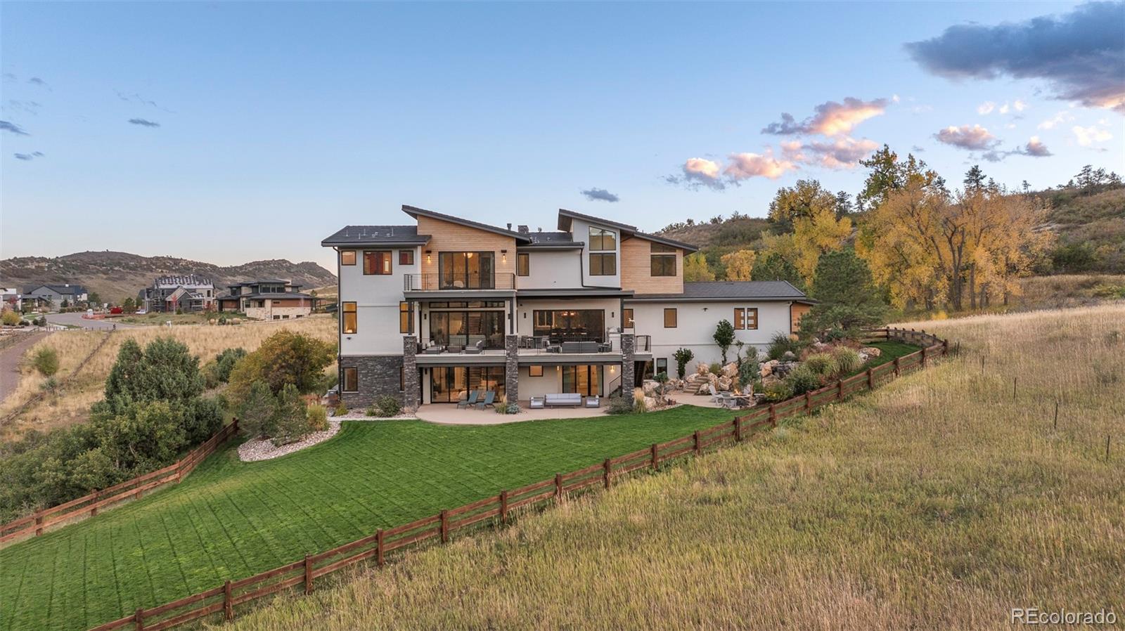 15480 Dinosaur Ridge Road Morrison, CO 80465 - Photo 50 of 50 a view of a house with a big yard and large trees
