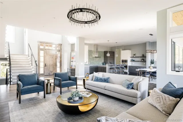 a living room with furniture potted plant and a window