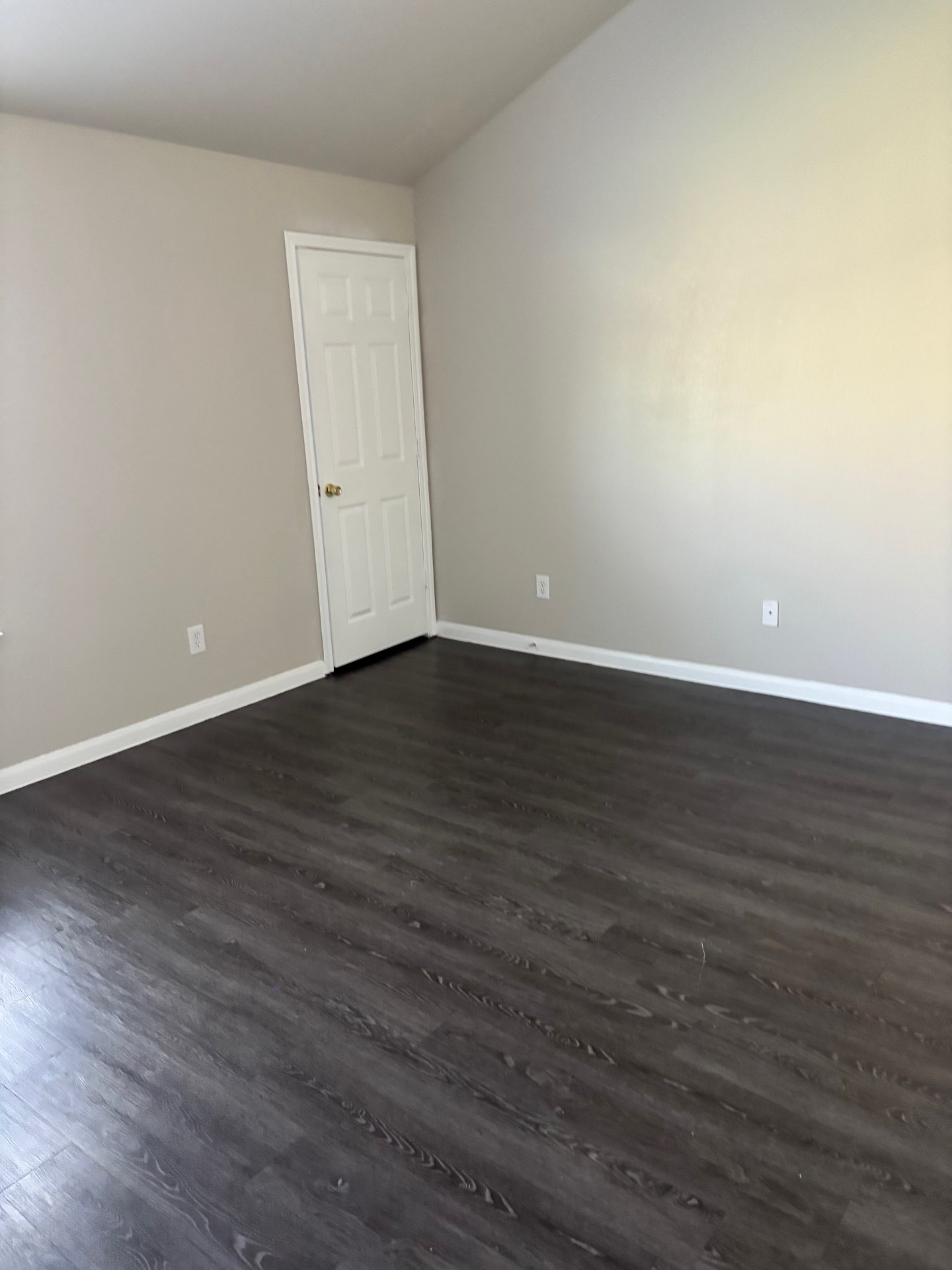 1410 Bergin Court, Unit B Georgetown, TX 78626 - Photo 11 of 13 a view of an empty room with wooden floor