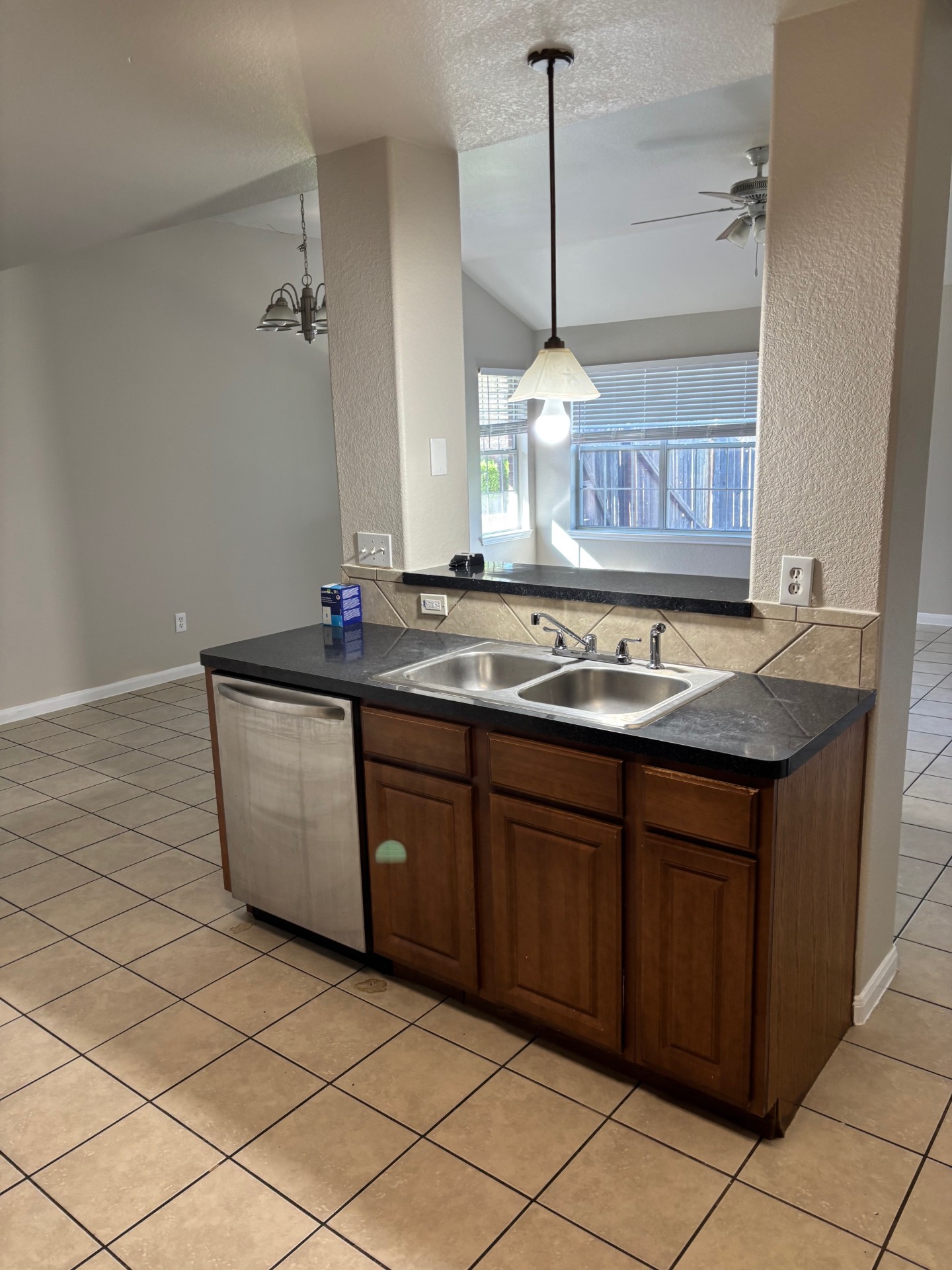 1410 Bergin Court, Unit B Georgetown, TX 78626 - Photo 5 of 13 a kitchen with stainless steel appliances granite countertop a sink and a wooden cabinets
