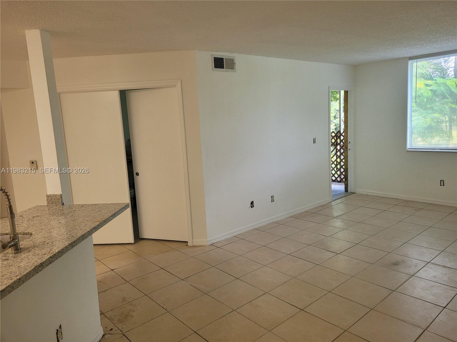 4035 West McNab Road, Unit F103 Pompano Beach, FL 33069 - Photo 17 of 32 LIVING ROOM