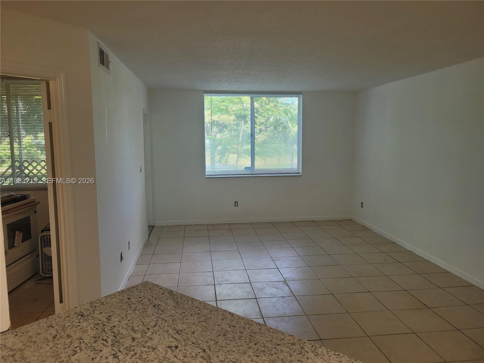 4035 West McNab Road, Unit F103 Pompano Beach, FL 33069 - Photo 7 of 32 LIVING ROOM