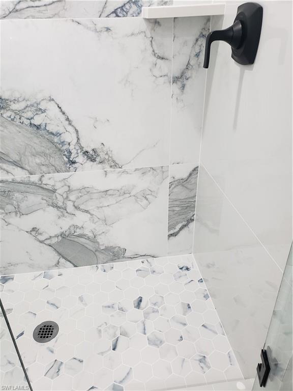 5435 Rattlesnake Hammock Road, Unit E102 Naples, FL 34113 - Photo 20 of 32 a view of a bathtub