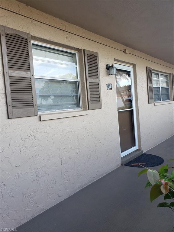 5435 Rattlesnake Hammock Road, Unit E102 Naples, FL 34113 - Photo 29 of 32 a view of front door