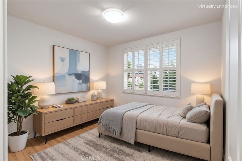 755 Francesca Drive, Unit 201 Walnut, CA 91789 - Photo 11 of 28 a spacious bedroom with a bed and a couch