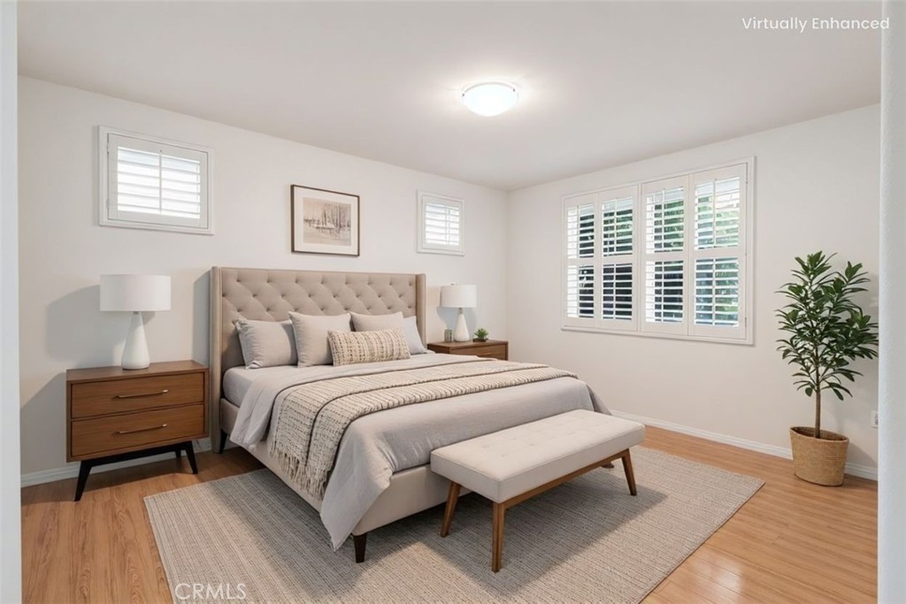 755 Francesca Drive, Unit 201 Walnut, CA 91789 - Photo 14 of 28 a bedroom with a bed and a couch