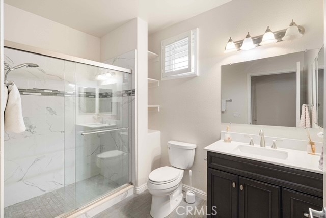 755 Francesca Drive, Unit 201 Walnut, CA 91789 - Photo 16 of 28 a bathroom with a sink toilet a mirror and shower