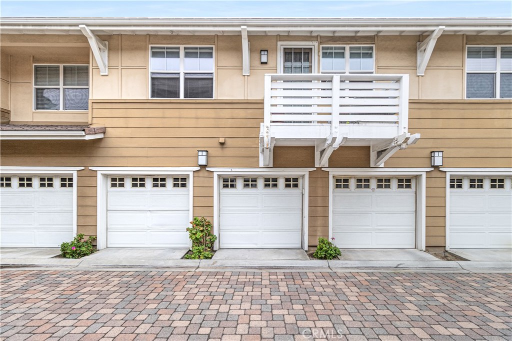 755 Francesca Drive, Unit 201 Walnut, CA 91789 - Photo 21 of 28 a front view of a house with a yard and garage