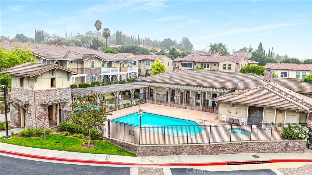 755 Francesca Drive, Unit 201 Walnut, CA 91789 - Photo 22 of 28 a view of a big house with a yard and plants