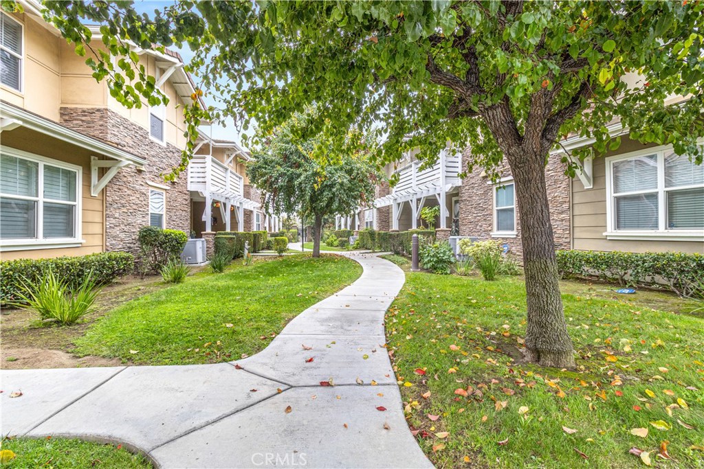 755 Francesca Drive, Unit 201 Walnut, CA 91789 - Photo 24 of 28 front view of a house with a yard