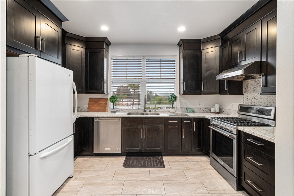 755 Francesca Drive, Unit 201 Walnut, CA 91789 - Photo 8 of 28 a large kitchen with stainless steel appliances granite countertop granite top and stove