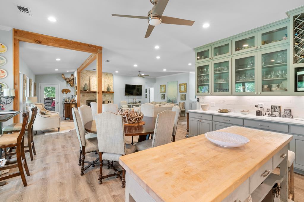 290 Cardinal Hill Road Ingram, TX 78025 - Photo 11 of 57 a large kitchen with a table and chairs