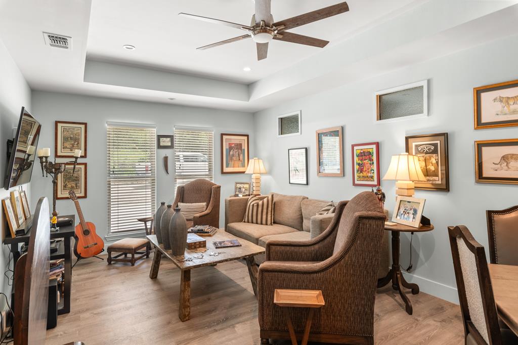 290 Cardinal Hill Road Ingram, TX 78025 - Photo 16 of 57 a living room with furniture a flat screen tv and a window
