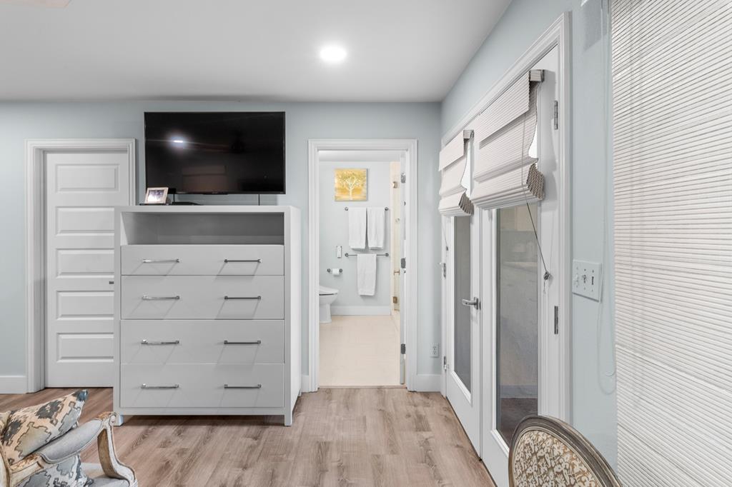 290 Cardinal Hill Road Ingram, TX 78025 - Photo 21 of 57 a view of a livingroom with wooden floor flat screen tv and cabinet