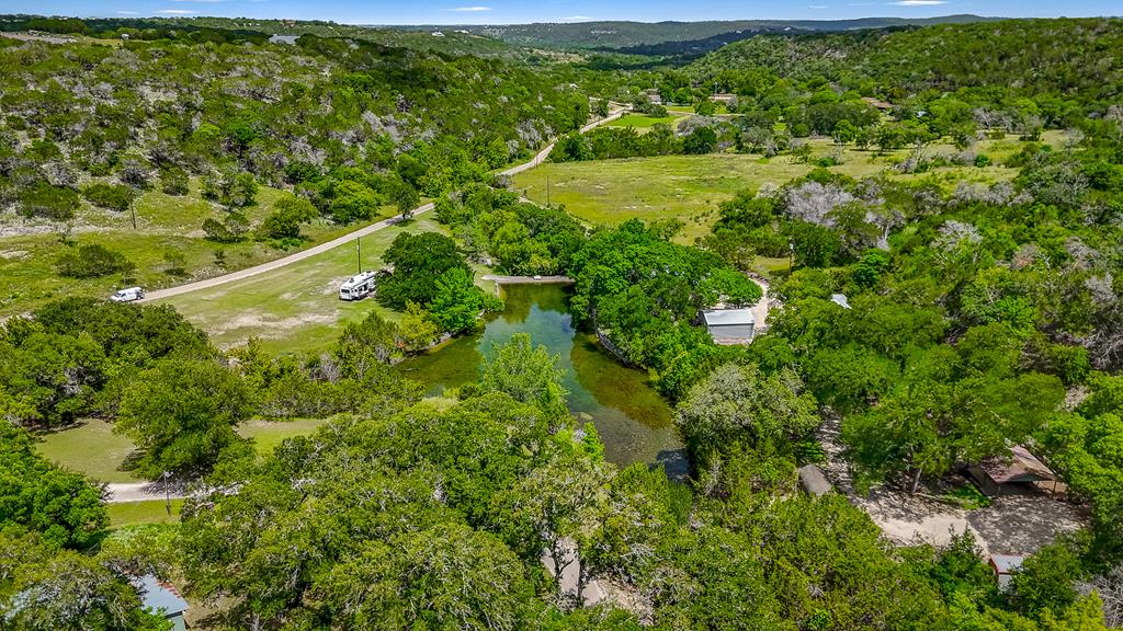 290 Cardinal Hill Road Ingram, TX 78025 - Photo 26 of 57 a view of a big yard with large trees and plants