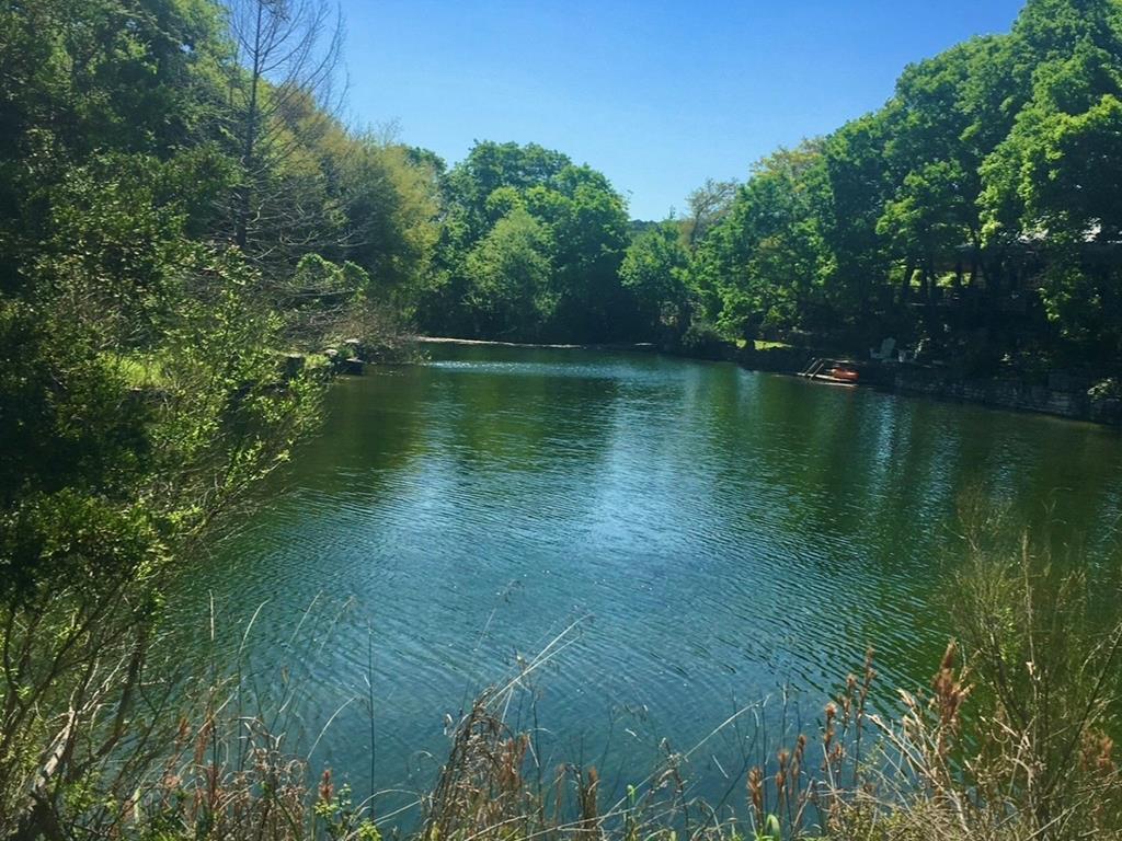 290 Cardinal Hill Road Ingram, TX 78025 - Photo 49 of 57 a view of a lake with a yard