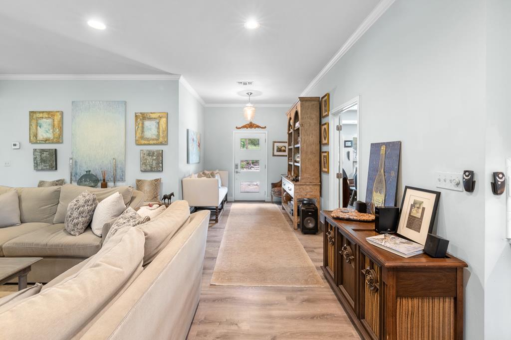 290 Cardinal Hill Road Ingram, TX 78025 - Photo 7 of 57 a living room with furniture and a chandelier