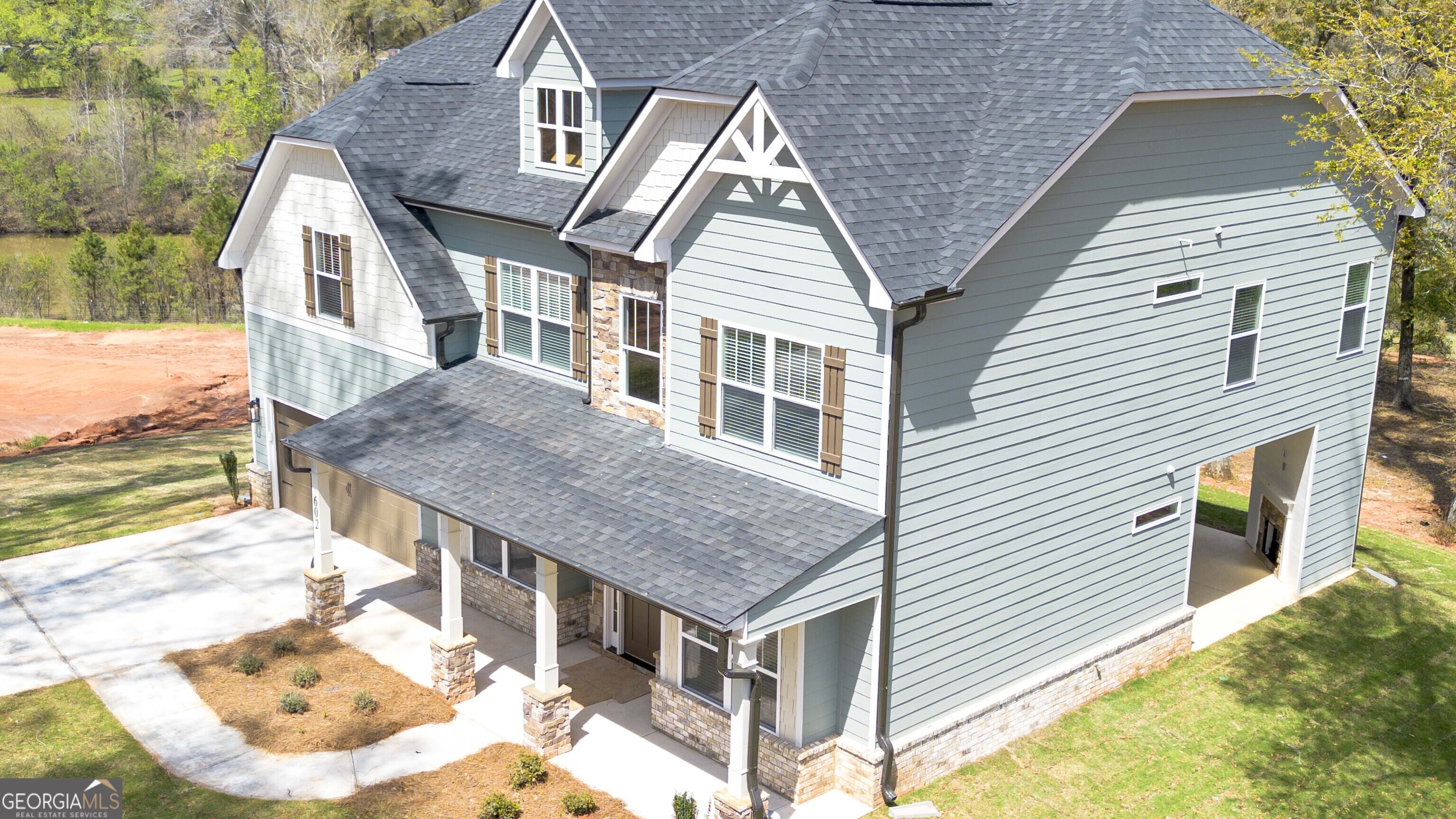 604 Beaver Court Perry, GA 31069 - Photo 39 of 40 a aerial view of a house with roof deck