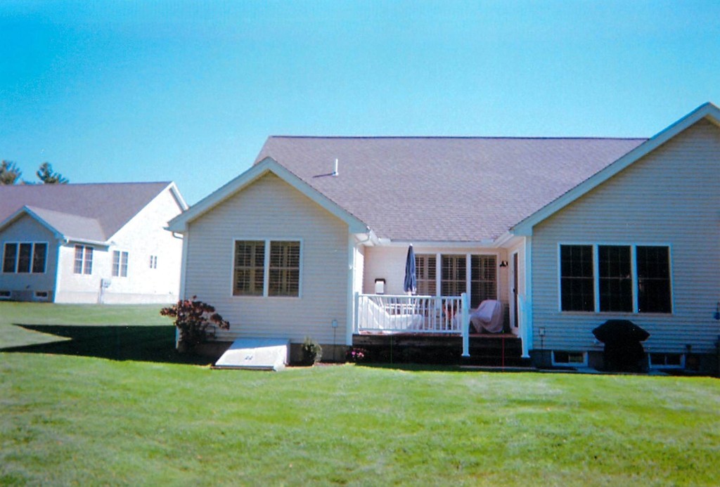 50 Riley Road, Unit 25 Lunenburg, MA 01462 - Photo 3 of 30 a backyard of a house with table and chairs
