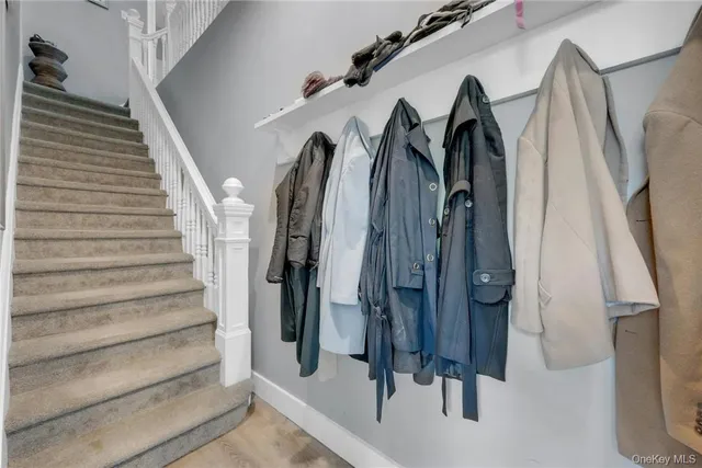 a view of walk in closet with clothes