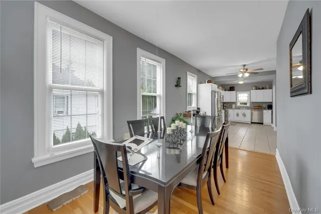 a dining room with furniture and window
