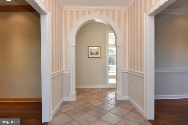 a spacious bathroom with a double vanity sink a mirror and a shower