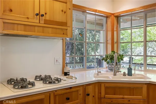 a view of a dining room with furniture and a kitchen