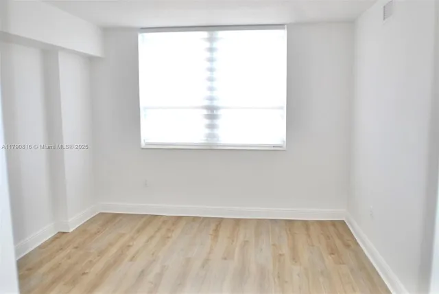 a view of a room that has a window in it