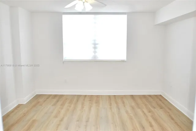 a view of a room that has a window