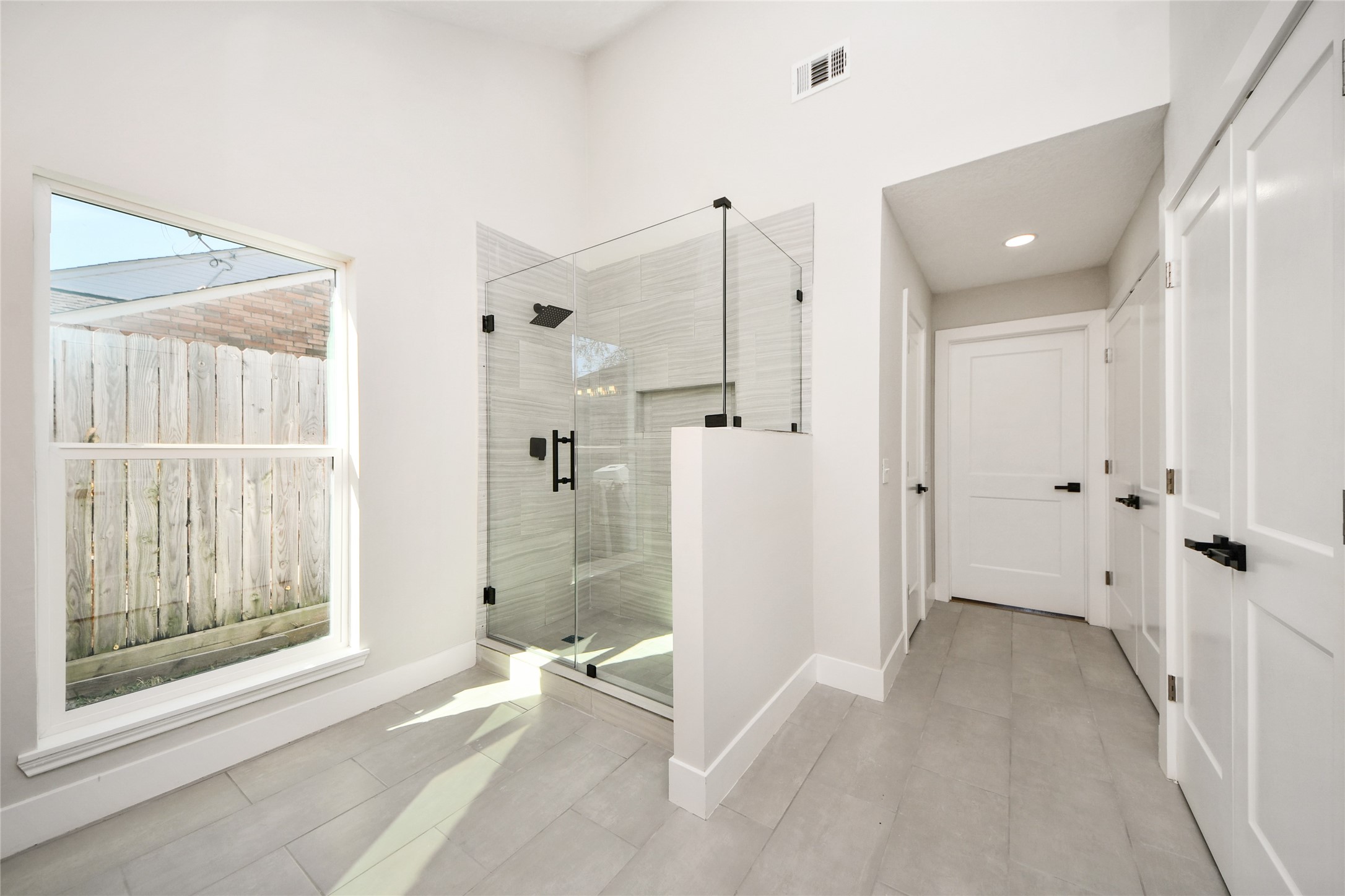 10223 Dude Road Houston, TX 77064 - Photo 28 of 47 Primary bedroom view of stand up shower an glass door