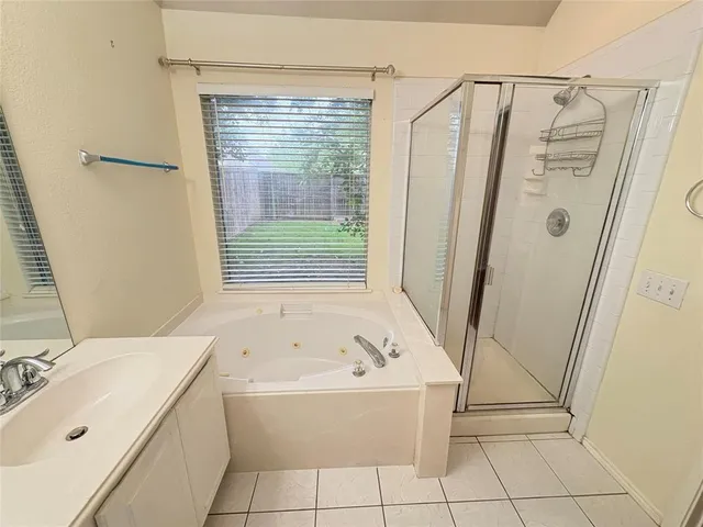 a bathroom with a bathtub and a sink