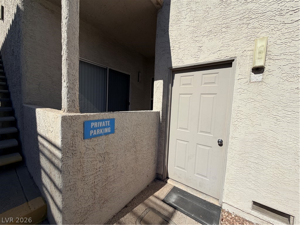6250 West Flamingo Road, Unit 4 Las Vegas, NV 89103 - Photo 38 of 45 This entry offers a glimpse of a structured exterior with textured walls.