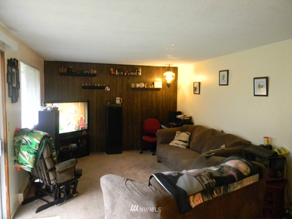 515 Roe Street Steilacoom, WA 98388 - Photo 3 of 9 a living room with furniture and a flat screen tv